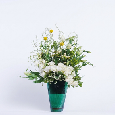 Green Glass Vase with Emerald Bloom Arrangement